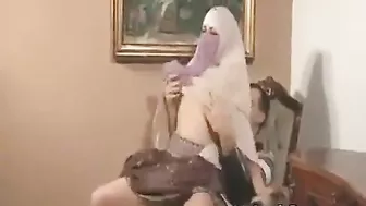 Muslim beauty in hijab elegantly sucks and fucks on camera