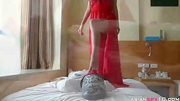 Chinese girl caresses boyfriend's cock with feet and tender mouth besides he licks hairy pussy through the mask