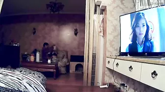 Young Chinese couple set cheap amateur camera to film their fucking by TV