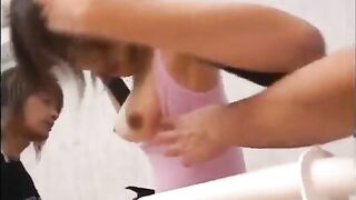 Young Asian lady in pink swimsuit has threesome workout