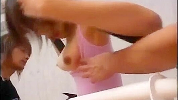 Young Asian lady in pink swimsuit has threesome workout