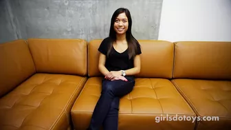 Asian totty spoils pussy with sex toys on mustard sofa Asian totty spoils pussy with sex toys on mustard sofa