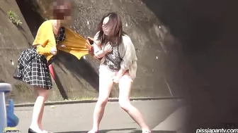 Japanese girl watches how girlfriend takes a piss on street Japanese girl watches how girlfriend takes a piss on street