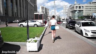 Brave brunette Jeny Smith walks around streets dressed in short skirt that exposes her trimmed cunny