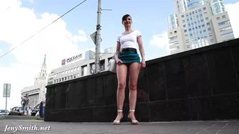 Brave brunette Jeny Smith walks around streets dressed in short skirt that exposes her trimmed cunny