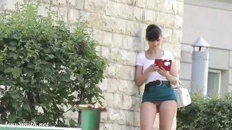 Brave brunette Jeny Smith walks around streets dressed in short skirt that exposes her trimmed cunny