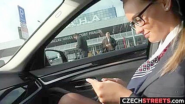 Sexy stewardess Andrea with nice glasses services her Uber driver for cash in a public place in Praha