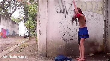 British cutie changes clothes and touches small pussy by dirty wall near public road
