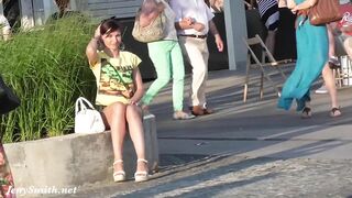 Jeny Smith walks around European city and flashes nice pussy