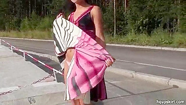 Teen flashes her small shaved pussy lifting summer dress up