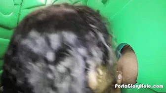 Curly-haired Ebony sucks strangers' cocks through the gloryhole