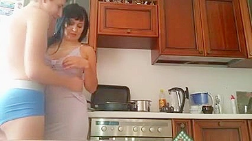 Incest fun of the brunette MILF and son takes place in the kitchen