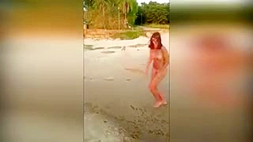 Girl runs around naked on beach chasing after dog who stole