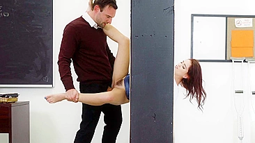 Red-haired coed is stuck in the wall and teacher fucks her XXX hole
