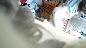 Nerdy mom was caught on spy cam masturbating in bedroom
