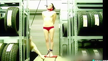 Naked girl suspended by the neck in her boyfriend's garage