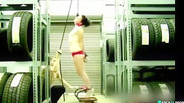 Naked girl suspended by the neck in her boyfriend's garage