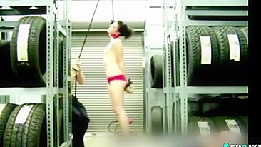 Naked girl suspended by the neck in her boyfriend's garage