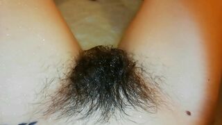 Narcissistic girl likes nothing more than playing with a hairy bush