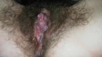 Close-up video of the girl masturbating hairy cunt with a vibrator
