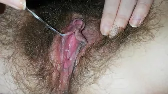 Close-up video of the girl masturbating hairy cunt with a vibrator