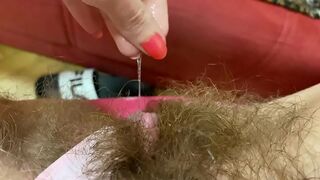 Female with a hairy bush takes a vibrator to satisfy herself