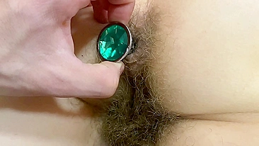 Boyfriend shoves a butt plug into ass of blonde with hairy bush