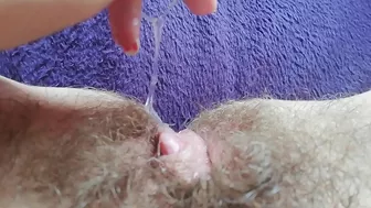 Naughty mom captures on camera how she is fingering own hairy bush