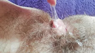 Naughty mom captures on camera how she is fingering own hairy bush