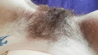 Naughty mom captures on camera how she is fingering own hairy bush