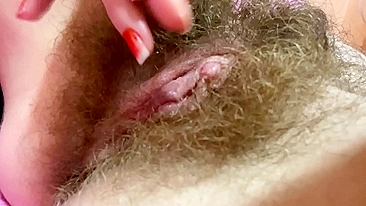 Unsatisfied mom with bush feels better while touching own big clit