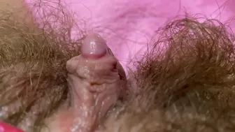 Belle with hairy bush touches big clit till achieving squirt orgasm
