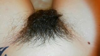 Amateur mom with super hairy bush relaxes naked in the bathroom