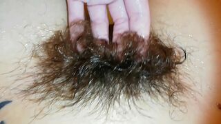 Amateur mom with super hairy bush relaxes naked in the bathroom