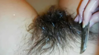 Amateur mom with super hairy bush relaxes naked in the bathroom