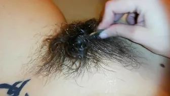 Amateur mom with super hairy bush relaxes naked in the bathroom