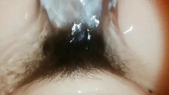 Amateur mom with super hairy bush relaxes naked in the bathroom