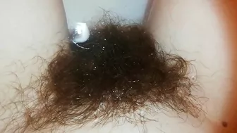 Amateur mom with super hairy bush relaxes naked in the bathroom