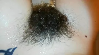 Amateur mom with super hairy bush relaxes naked in the bathroom