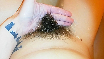 Amateur mom with super hairy bush relaxes naked in the bathroom