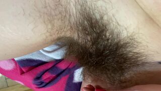 Mom demonstrates her hairy cunt with huge bush in extreme close up video