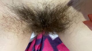 Mom demonstrates her hairy cunt with huge bush in extreme close up video