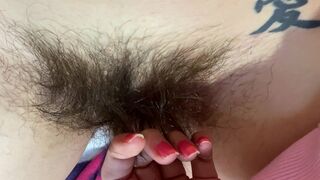 Mom demonstrates her hairy cunt with huge bush in extreme close up video