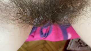 Mom demonstrates her hairy cunt with huge bush in extreme close up video