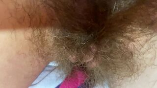 Mom demonstrates her hairy cunt with huge bush in extreme close up video