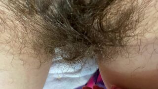 Mom demonstrates her hairy cunt with huge bush in extreme close up video