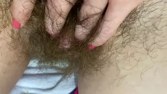 Mom demonstrates her hairy cunt with huge bush in extreme close up video