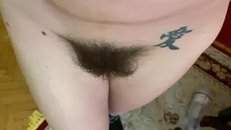 Mom demonstrates her hairy cunt with huge bush in extreme close up video