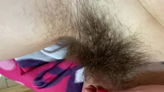 Mom demonstrates her hairy cunt with huge bush in extreme close up video