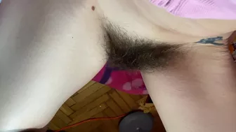 Mom demonstrates her hairy cunt with huge bush in extreme close up video